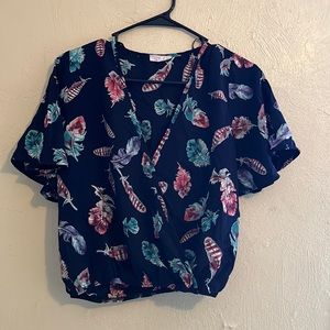 Dark blue v neck blouse with colorful feathers